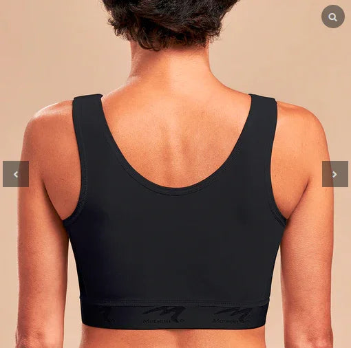 Woman wearing black Marena recovery bra, back view, seamless design, neutral background